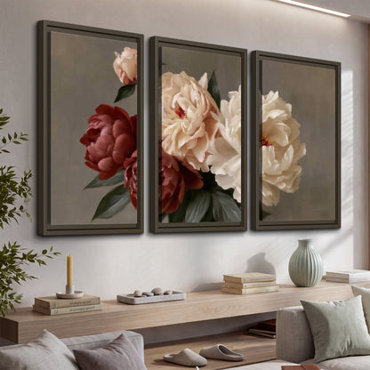 Large blush peonies and rust-colored flowers in a softly shaded arrangement 3 piece framed canvas wall art displayed in a console