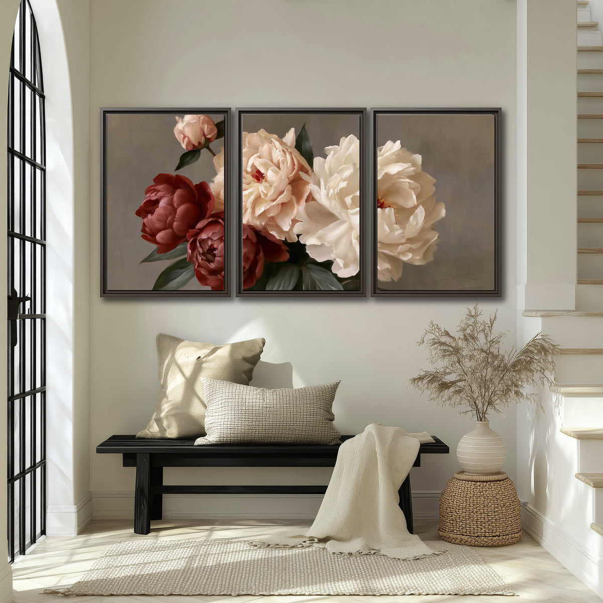 Large blush peonies and rust-colored flowers in a softly shaded arrangement 3 piece framed canvas wall art displayed in a entryway