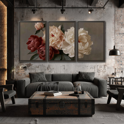 Large blush peonies and rust-colored flowers in a softly shaded arrangement 3 piece framed canvas wall art displayed in a industrial room