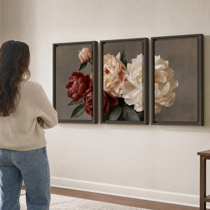 Large blush peonies and rust-colored flowers in a softly shaded arrangement 3 piece framed canvas wall art three panel arrangement on a wall