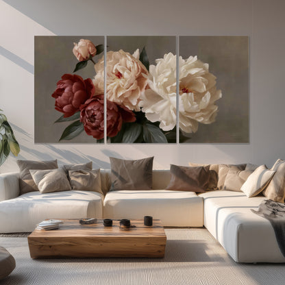 Large blush peonies and rust-colored flowers in a softly shaded arrangement set of 3 poster prints displayed in a living room