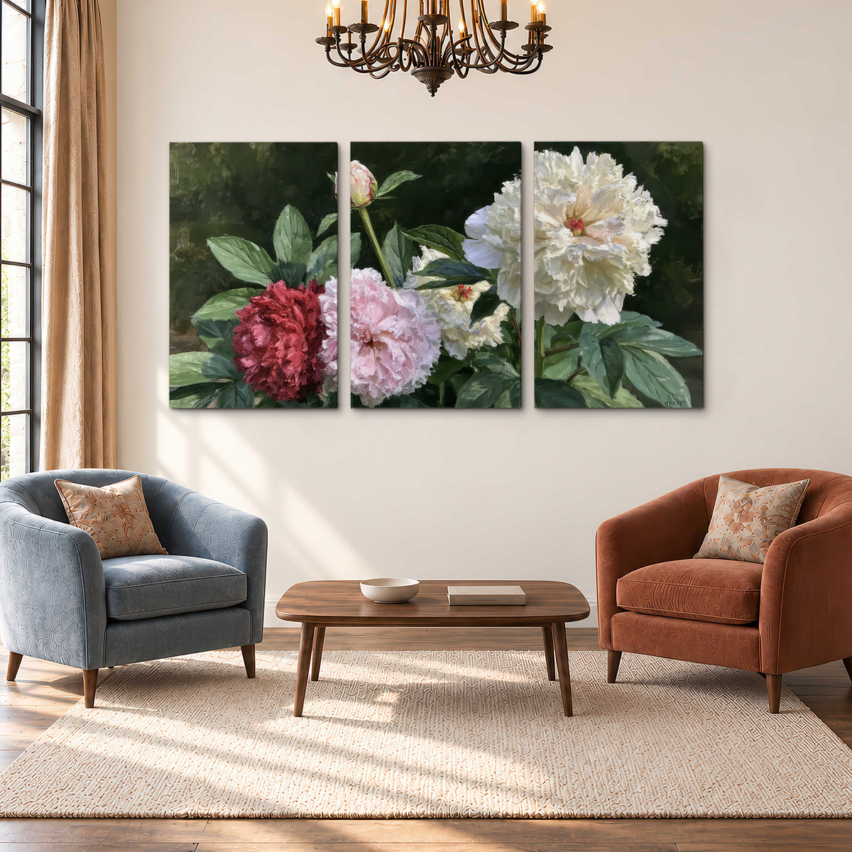 Cream, blush and red peonies surrounded by fresh green leaves 3 piece canvas wall art styled in an interior