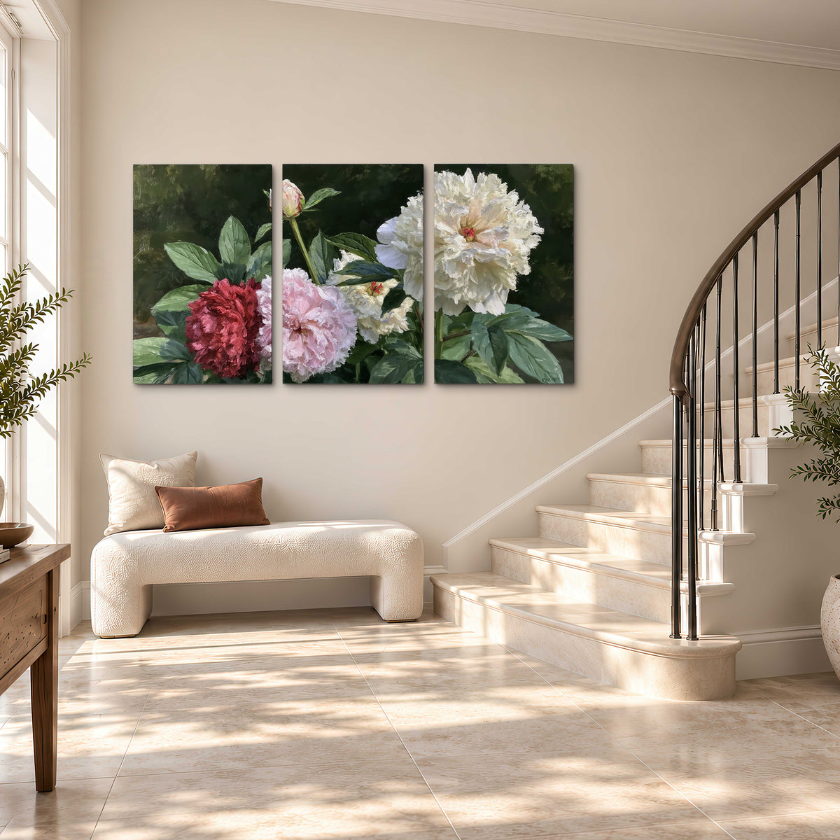 Cream, blush and red peonies surrounded by fresh green leaves 3 piece canvas wall art styled in an interior