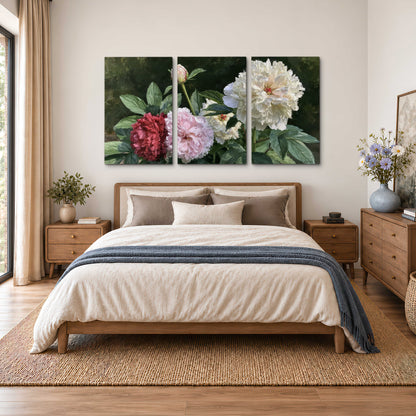 Cream, blush and red peonies surrounded by fresh green leaves 3 piece canvas wall art styled in an interior