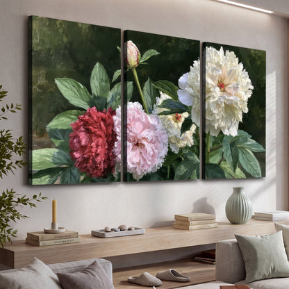 Cream, blush and red peonies surrounded by fresh green leaves 3 piece canvas wall art displayed in a console