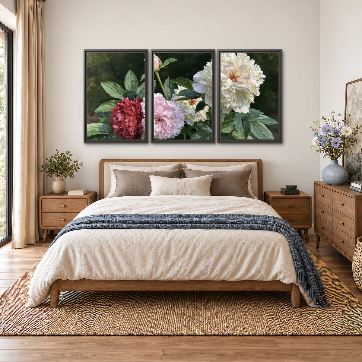 Cream, blush and red peonies surrounded by fresh green leaves 3 piece framed canvas wall art styled in an interior