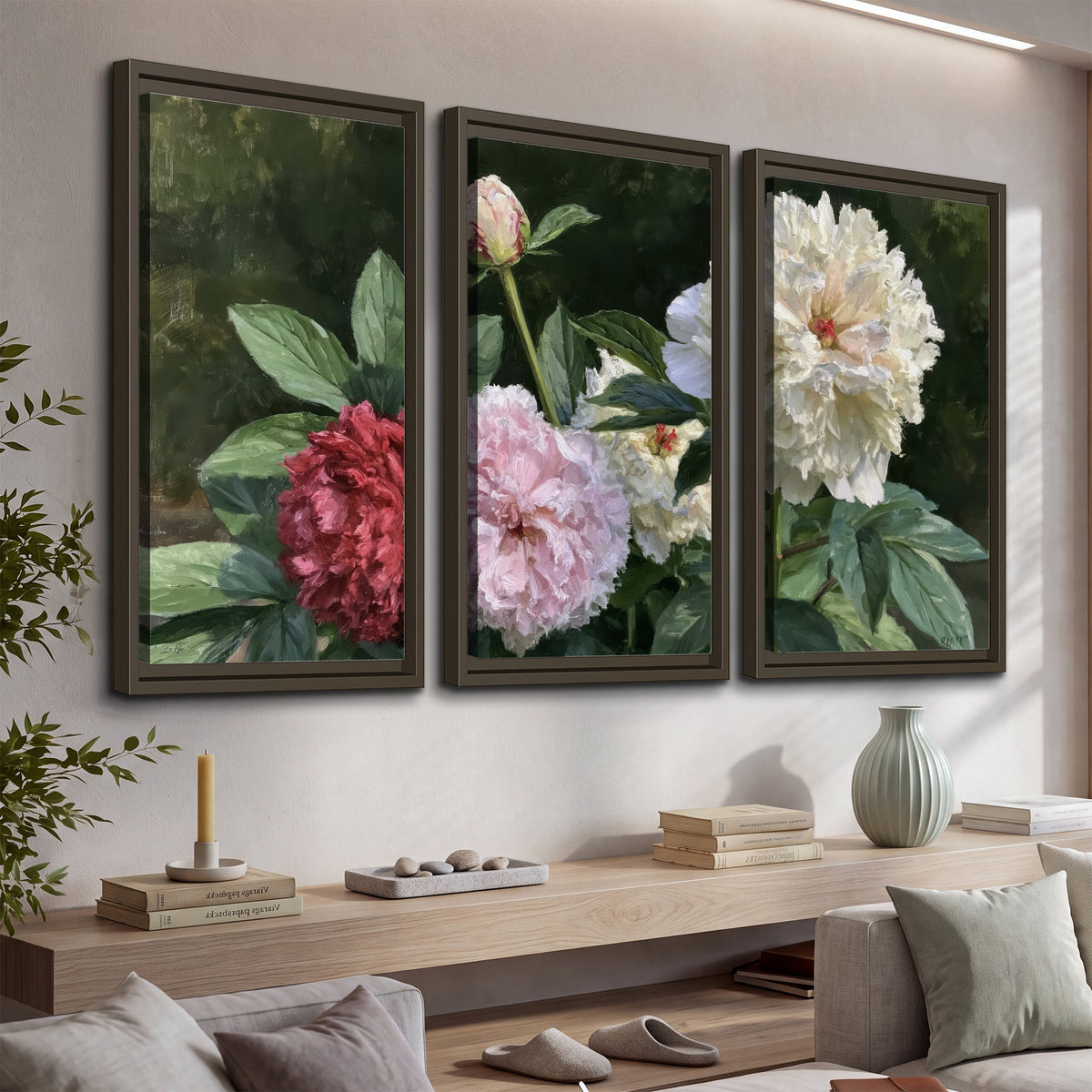 Cream, blush and red peonies surrounded by fresh green leaves 3 piece framed canvas wall art displayed in a console