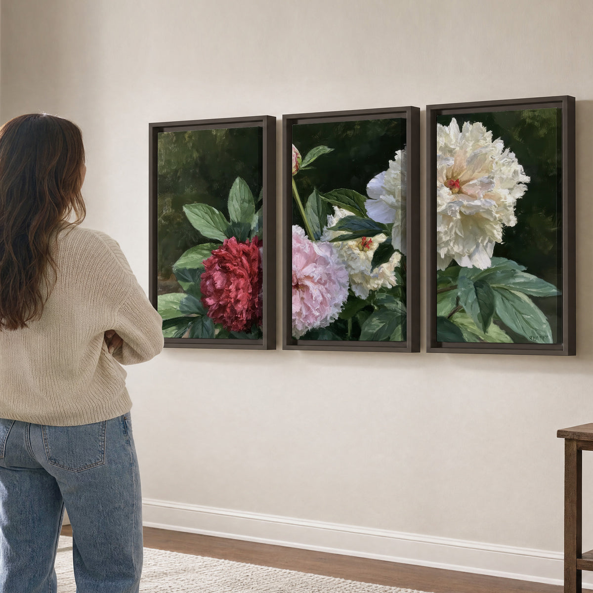 Cream, blush and red peonies surrounded by fresh green leaves 3 piece framed canvas wall art three panel arrangement on a wall