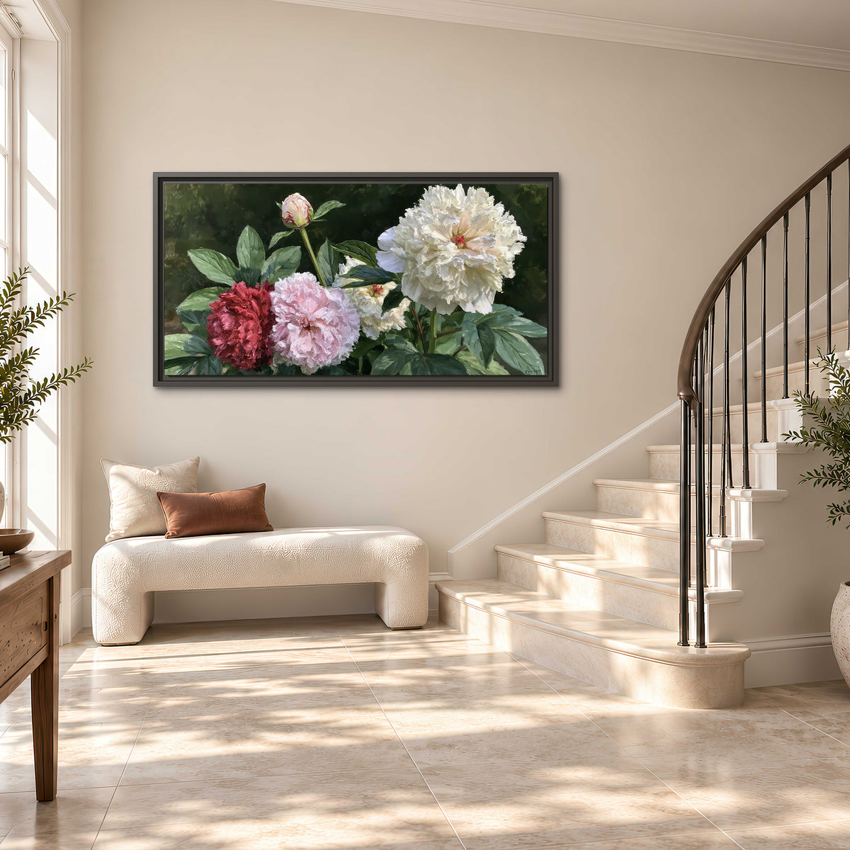 Cream, blush and red peonies surrounded by fresh green leaves single framed canvas wall art styled in an interior