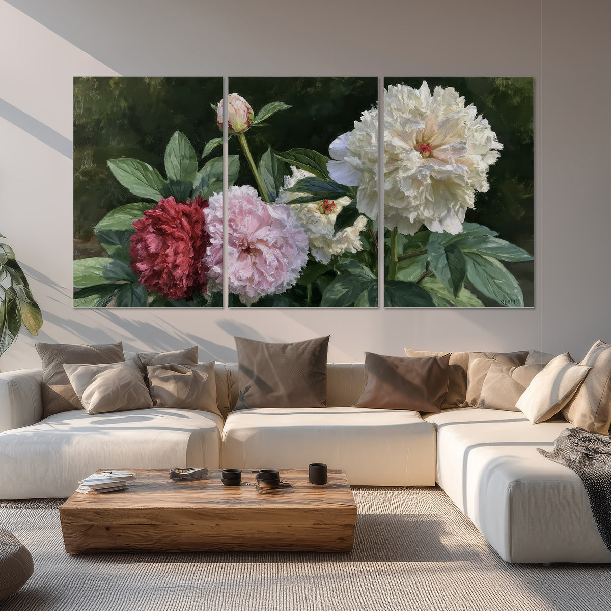 Cream, blush and red peonies surrounded by fresh green leaves set of 3 poster prints displayed in a living room