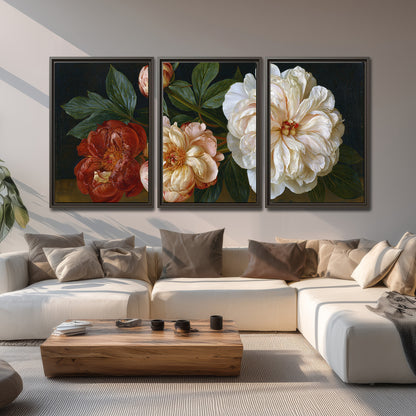 A large pale peony beside small ruby-red and peach flowers on a deep green ground 3 piece framed canvas wall art displayed in a living room