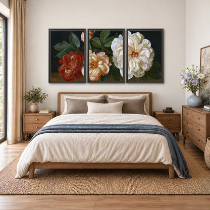 A large pale peony beside small ruby-red and peach flowers on a deep green ground 3 piece framed canvas wall art styled in an interior