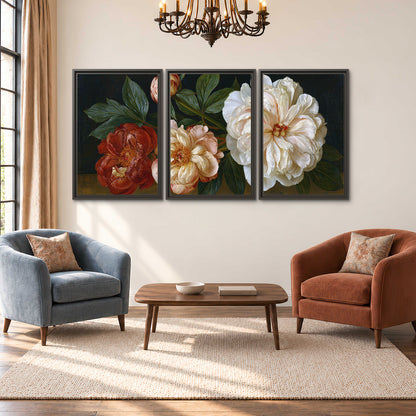 A large pale peony beside small ruby-red and peach flowers on a deep green ground 3 piece framed canvas wall art styled in an interior