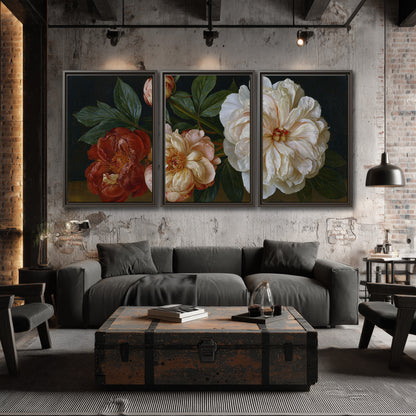 A large pale peony beside small ruby-red and peach flowers on a deep green ground 3 piece framed canvas wall art displayed in a industrial room