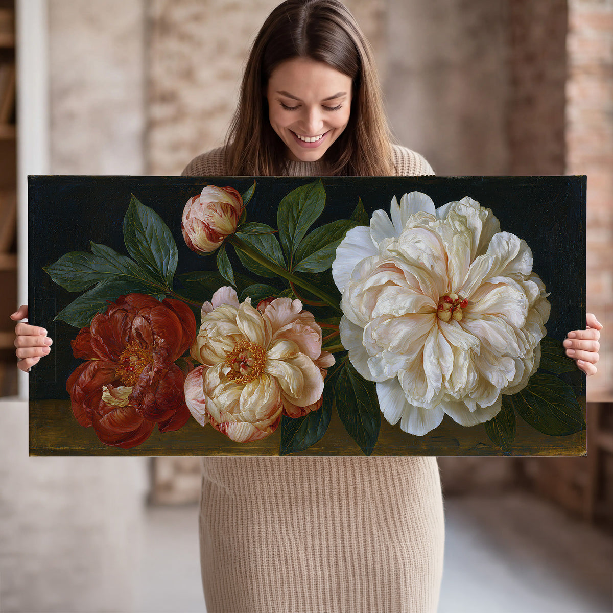 A large pale peony beside small ruby-red and peach flowers on a deep green ground single canvas wall art held in hands