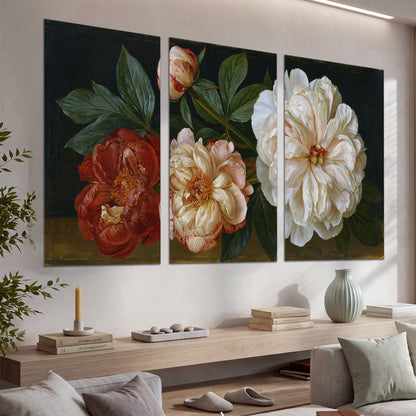 A large pale peony beside small ruby-red and peach flowers on a deep green ground set of 3 poster prints displayed in a console