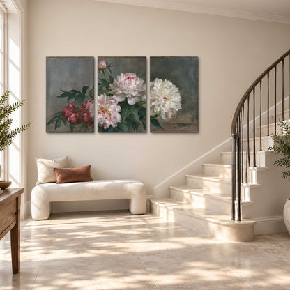 Cream and dusty pink peonies arranged against a muted gray-green background 3 piece canvas wall art styled in an interior