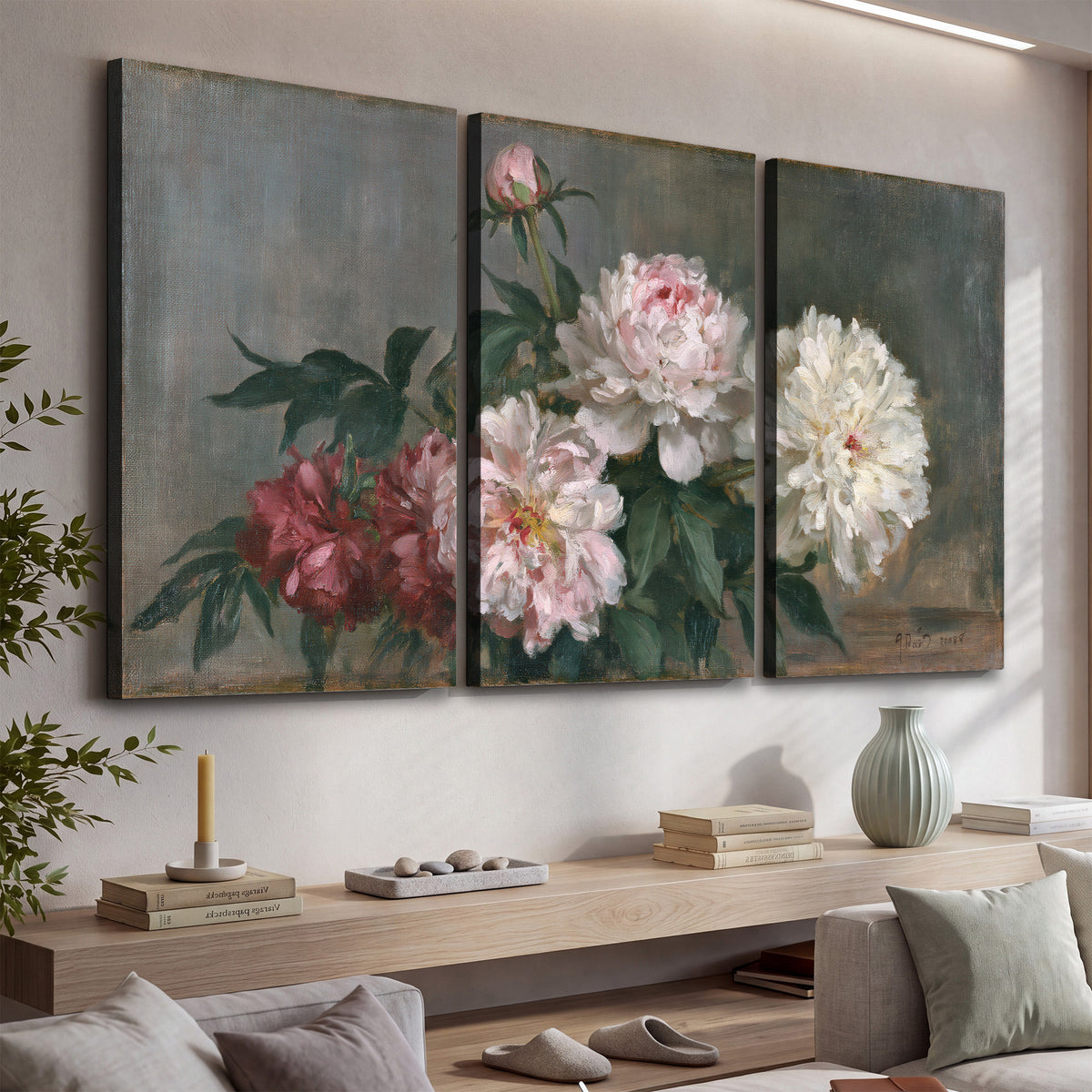 Cream and dusty pink peonies arranged against a muted gray-green background 3 piece canvas wall art displayed in a console