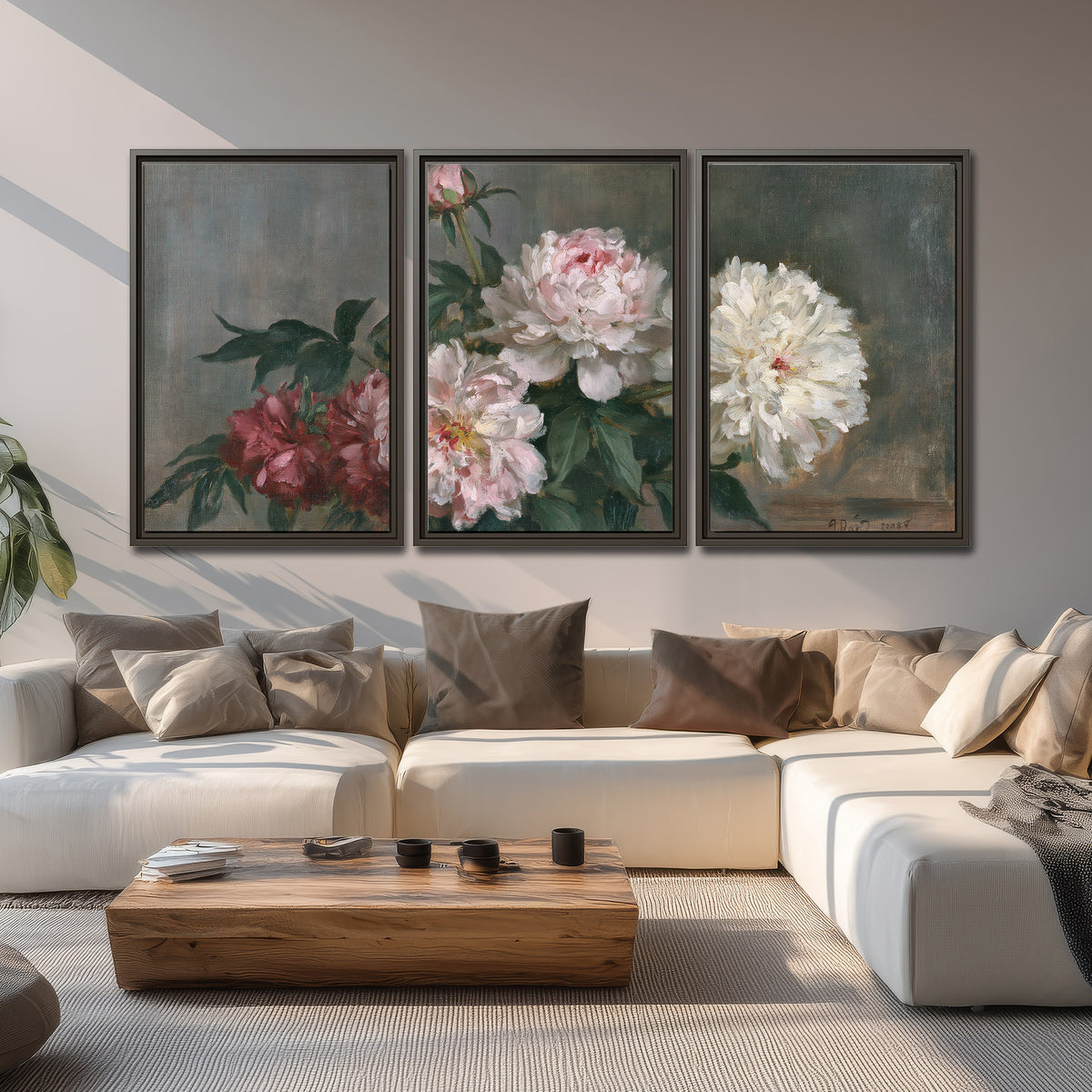 Cream and dusty pink peonies arranged against a muted gray-green background 3 piece framed canvas wall art displayed in a living room