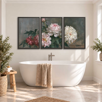 Cream and dusty pink peonies arranged against a muted gray-green background 3 piece framed canvas wall art styled in an interior