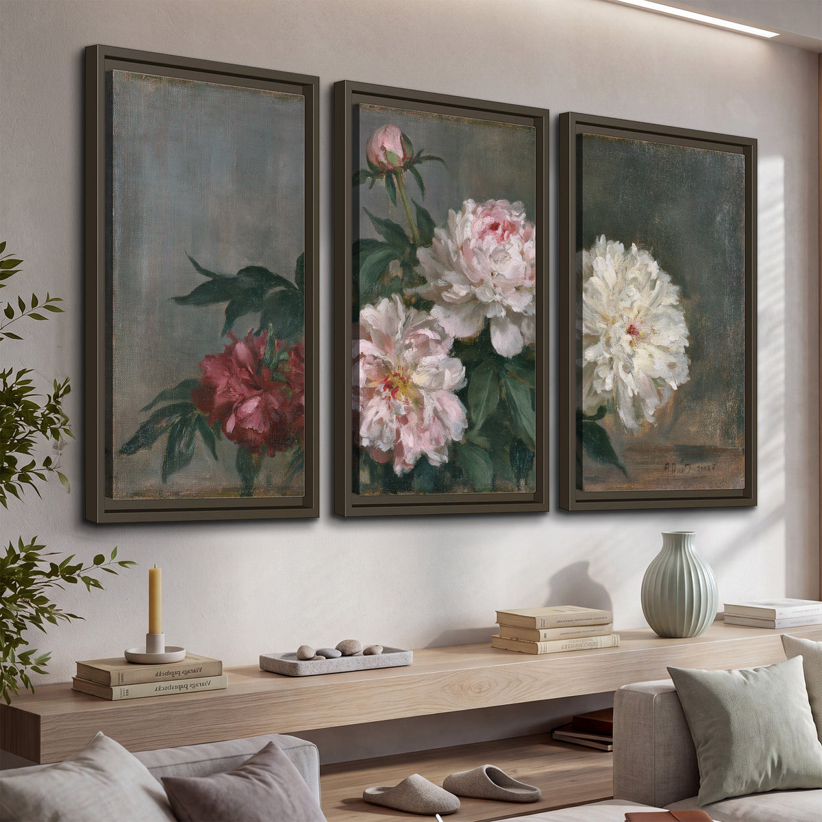 Cream and dusty pink peonies arranged against a muted gray-green background 3 piece framed canvas wall art displayed in a console