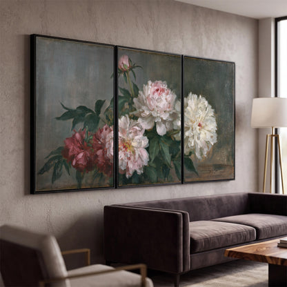 Cream and dusty pink peonies arranged against a muted gray-green background 3 piece framed canvas wall art displayed in a modern living room