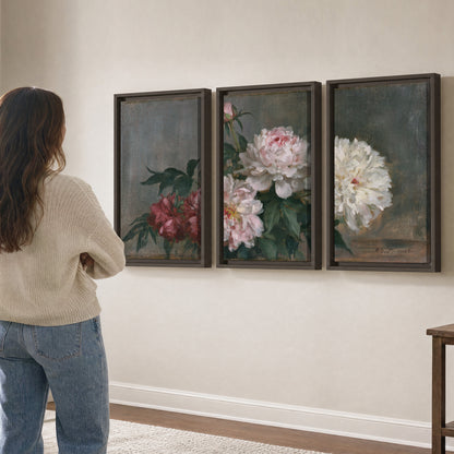 Cream and dusty pink peonies arranged against a muted gray-green background 3 piece framed canvas wall art three panel arrangement on a wall