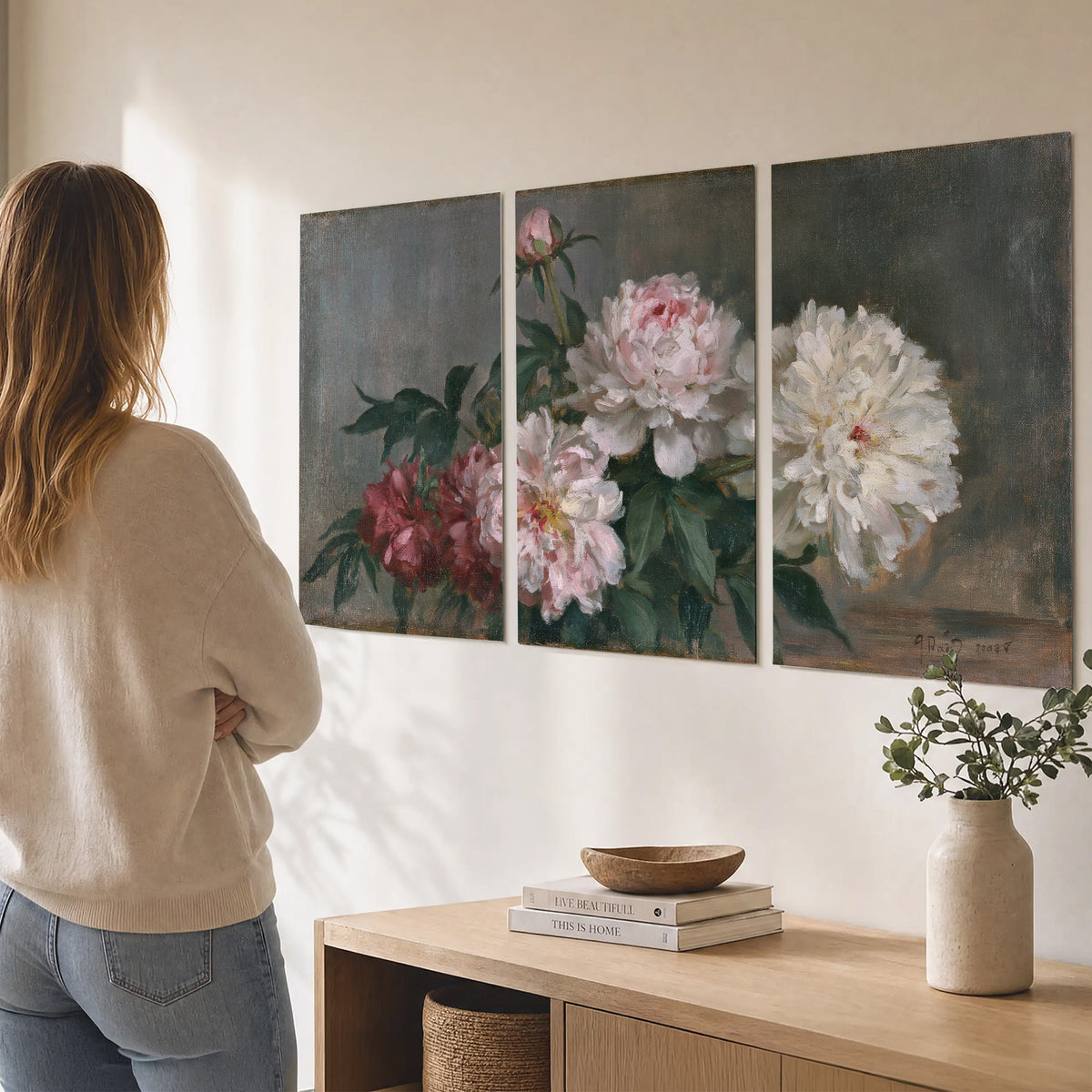 Cream and dusty pink peonies arranged against a muted gray-green background set of 3 poster prints three panel arrangement on a wall