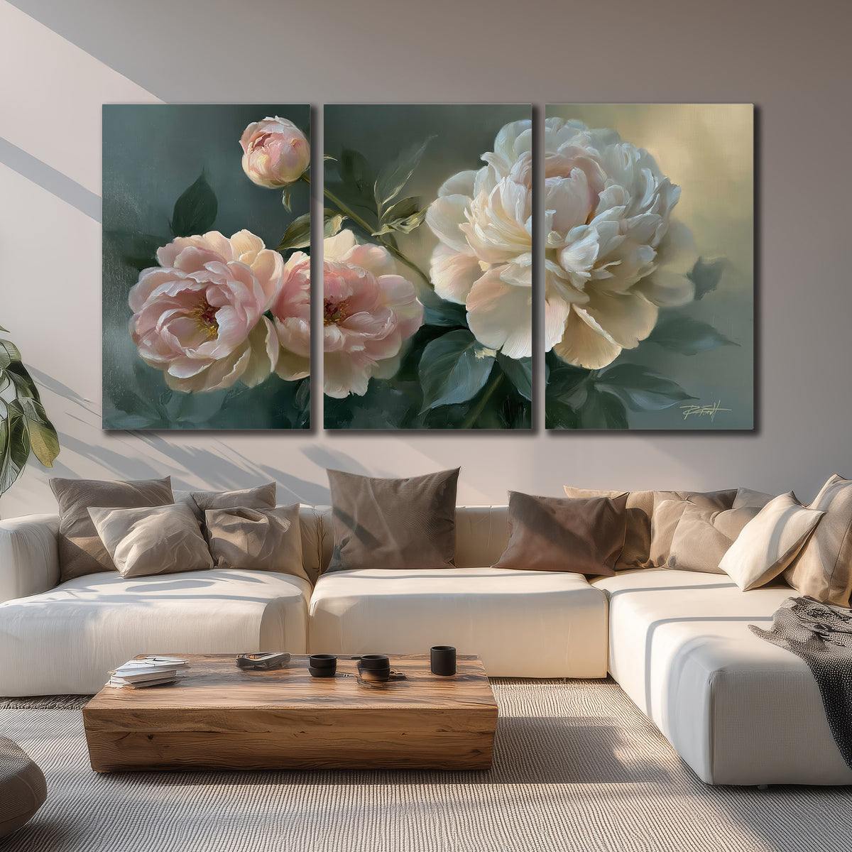 A large cream peony beside blush flowers and broad green leaves 3 piece canvas wall art displayed in a living room