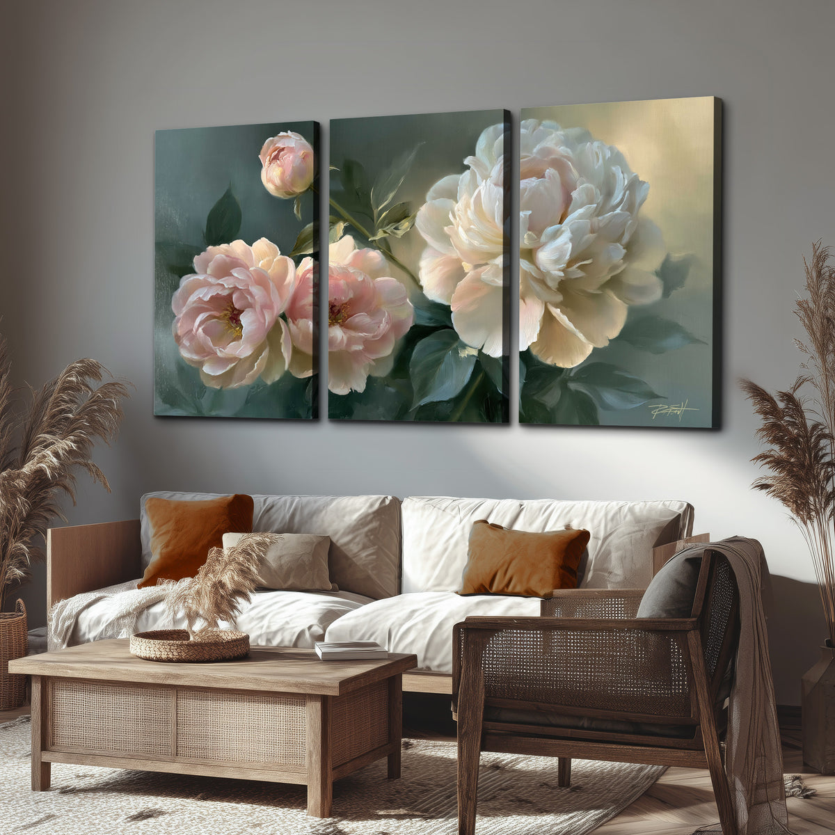 A large cream peony beside blush flowers and broad green leaves 3 piece canvas wall art displayed in a rustic living room
