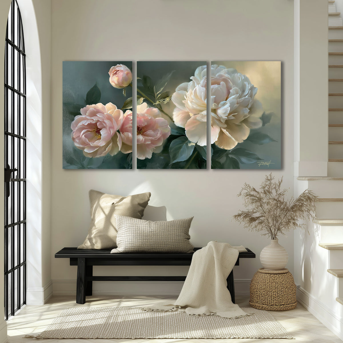 A large cream peony beside blush flowers and broad green leaves 3 piece canvas wall art displayed in a entryway