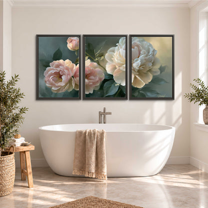 A large cream peony beside blush flowers and broad green leaves 3 piece framed canvas wall art styled in an interior