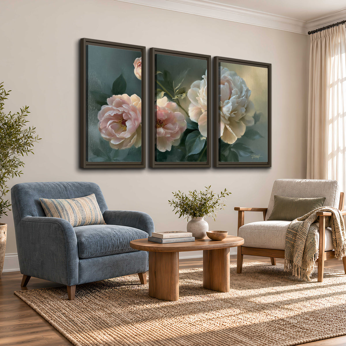 A large cream peony beside blush flowers and broad green leaves 3 piece framed canvas wall art styled in an interior