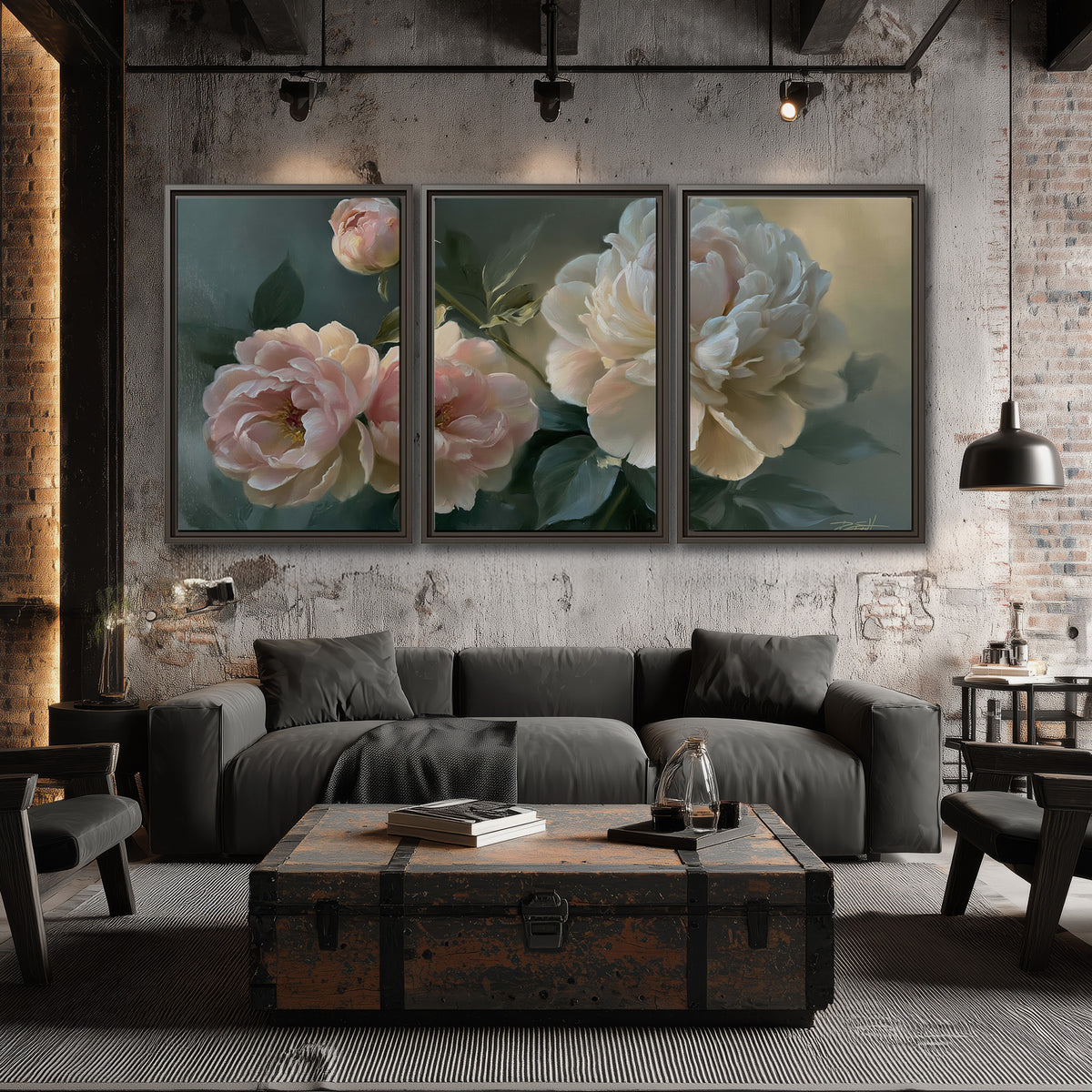 A large cream peony beside blush flowers and broad green leaves 3 piece framed canvas wall art displayed in a industrial room