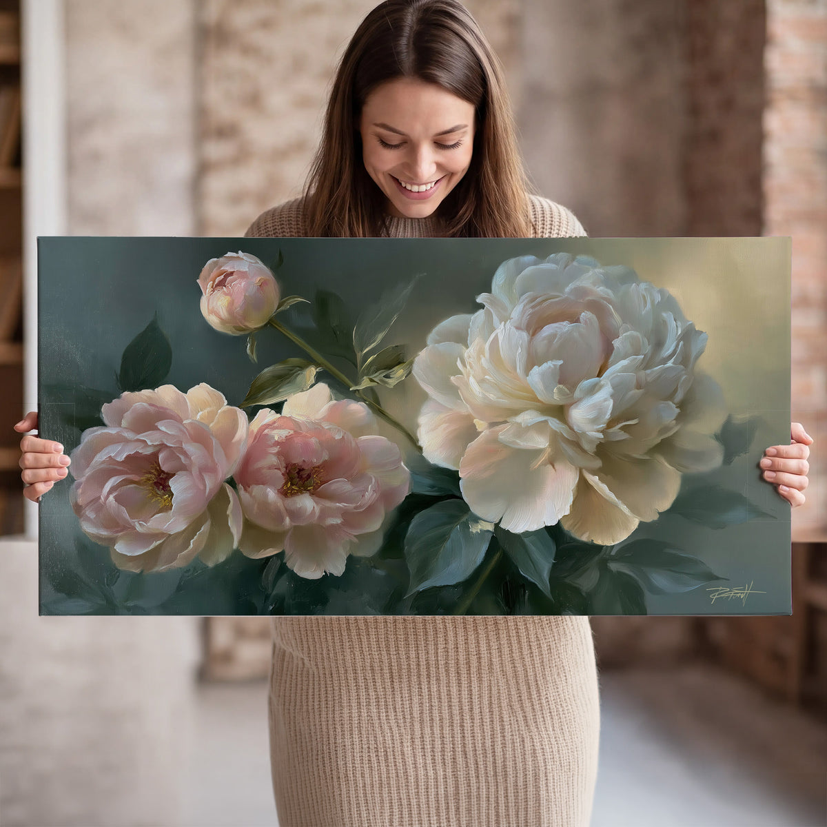 A large cream peony beside blush flowers and broad green leaves single canvas wall art held in hands