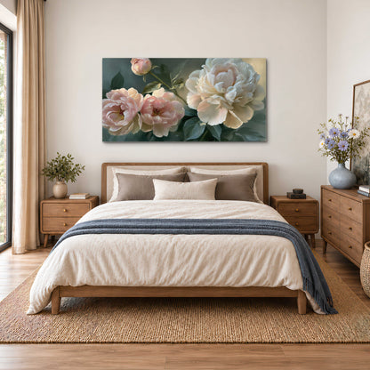 A large cream peony beside blush flowers and broad green leaves single canvas wall art styled in an interior