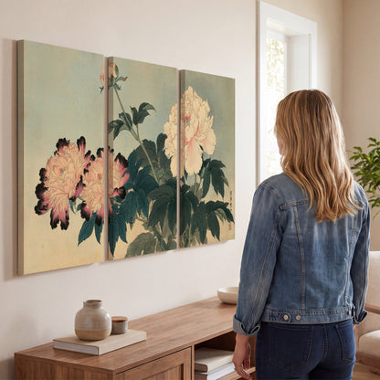 Pink and cream peonies with dark green leaves on a warm beige ground 3 piece canvas wall art three panel arrangement on a wall