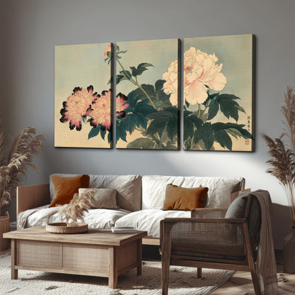 Pink and cream peonies with dark green leaves on a warm beige ground 3 piece canvas wall art displayed in a rustic living room