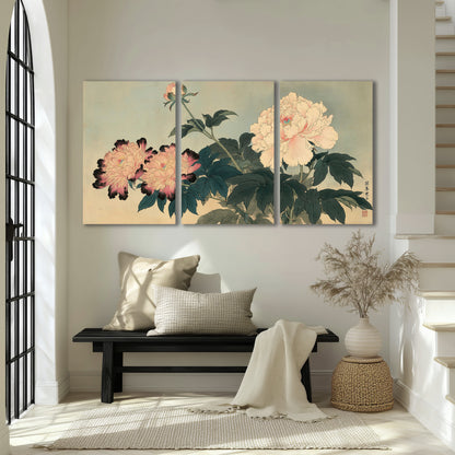 Pink and cream peonies with dark green leaves on a warm beige ground 3 piece canvas wall art displayed in a entryway