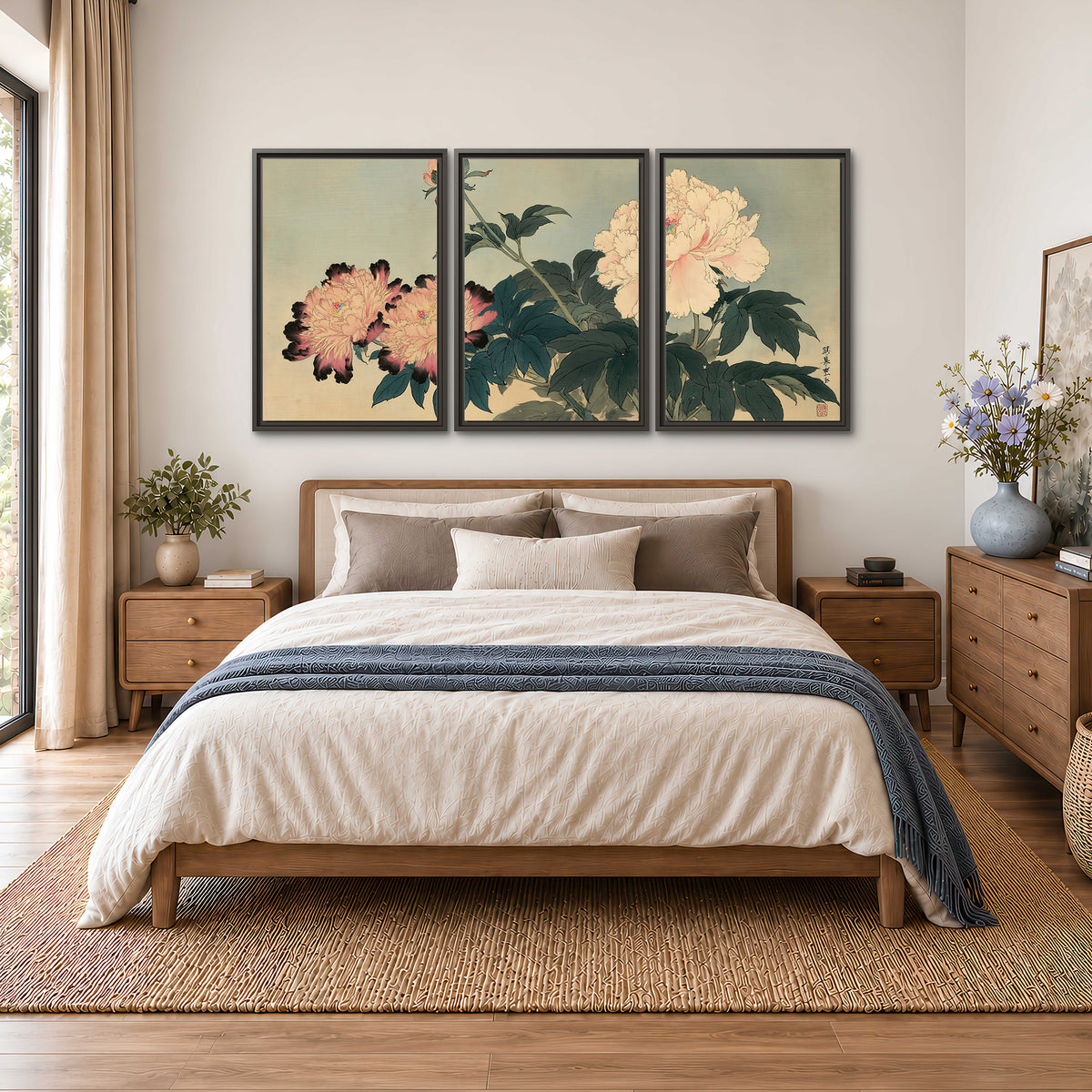 Pink and cream peonies with dark green leaves on a warm beige ground 3 piece framed canvas wall art styled in an interior