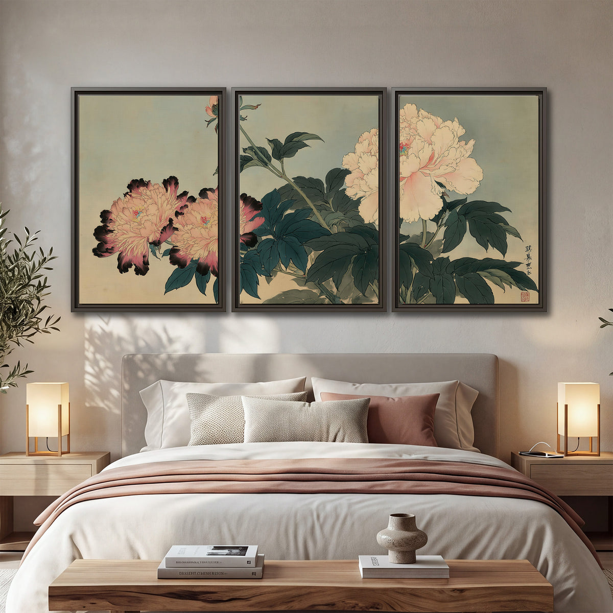Pink and cream peonies with dark green leaves on a warm beige ground 3 piece framed canvas wall art displayed in a bedroom