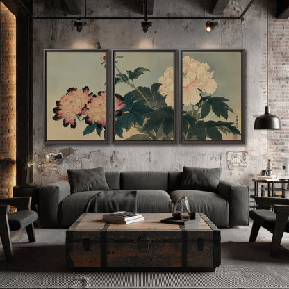Pink and cream peonies with dark green leaves on a warm beige ground 3 piece framed canvas wall art displayed in a industrial room