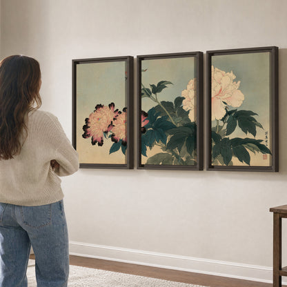 Pink and cream peonies with dark green leaves on a warm beige ground 3 piece framed canvas wall art three panel arrangement on a wall
