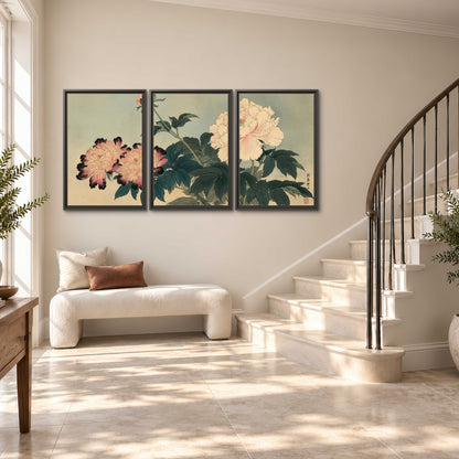 Pink and cream peonies with dark green leaves on a warm beige ground 3 piece framed canvas wall art styled in an interior