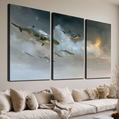 Whales drifting through pale dreamlike clouds toward a golden moon 3 piece canvas wall art room and product view
