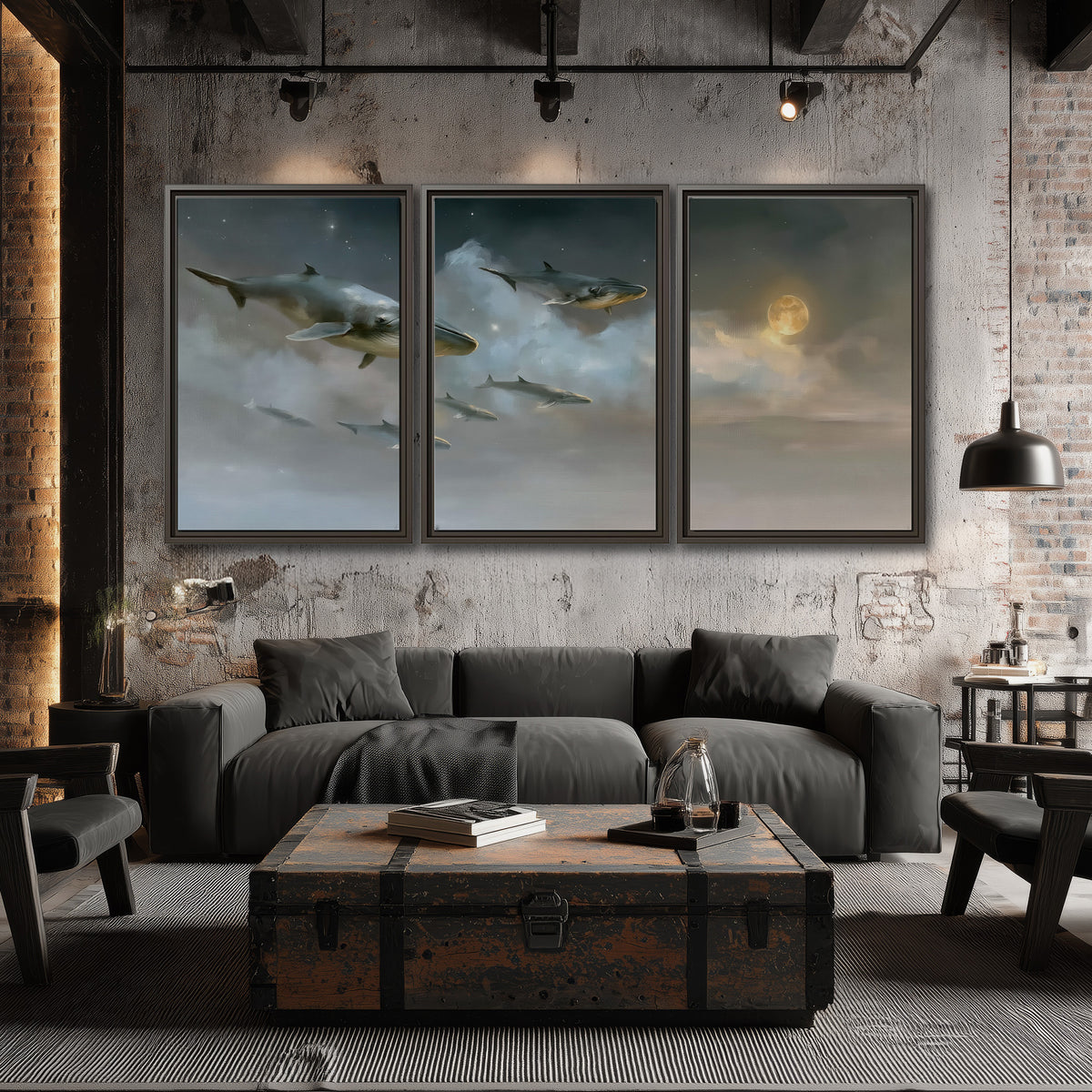 Whales drifting through pale dreamlike clouds toward a golden moon 3 piece framed canvas wall art displayed in a industrial room