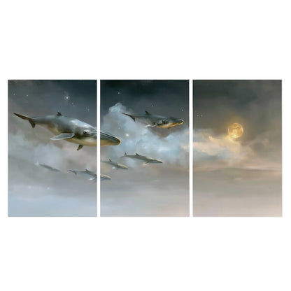 Whales drifting through pale dreamlike clouds toward a golden moon set of 3 poster prints viewed straight on