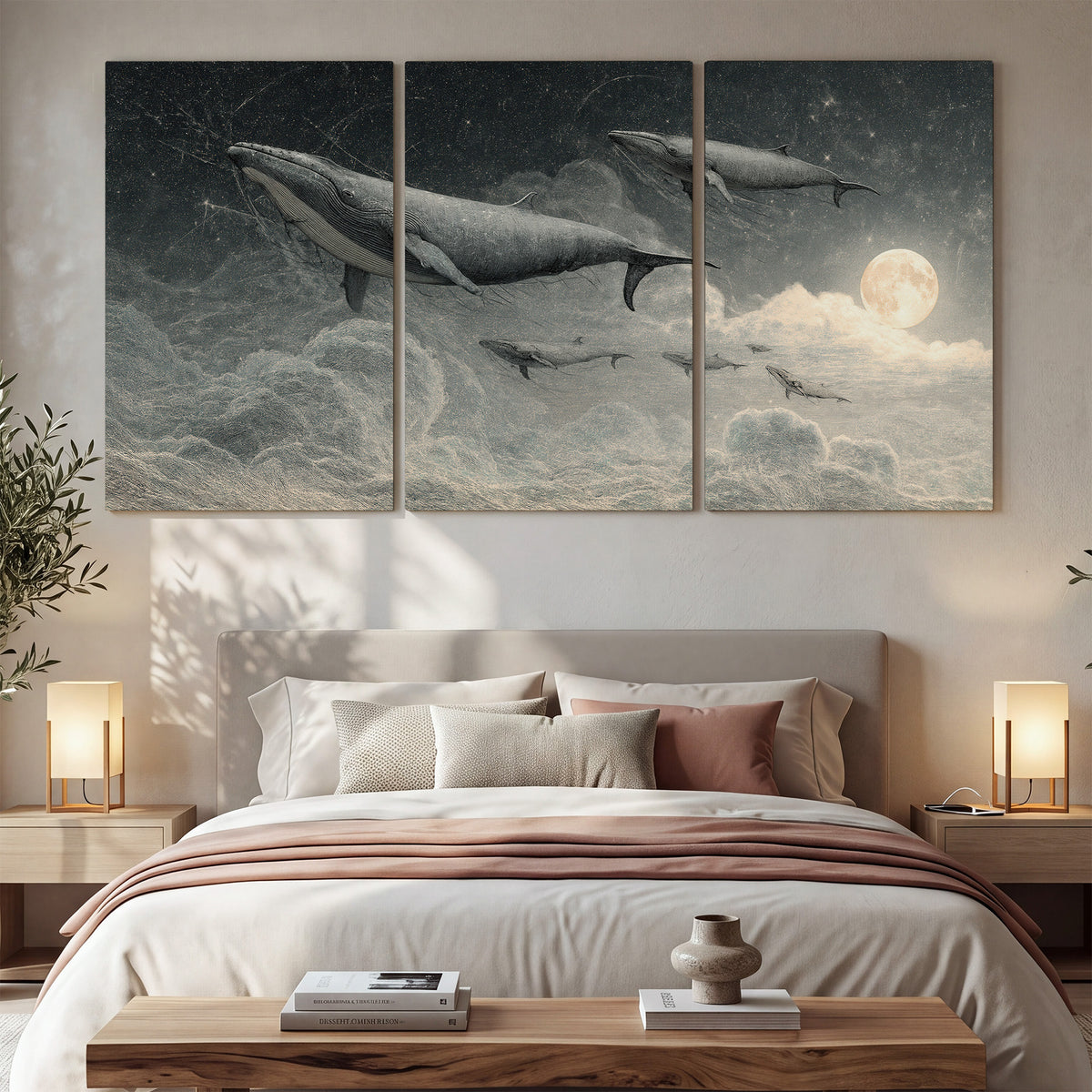 Monochrome whales floating over misty clouds beside a luminous painted moon 3 piece canvas wall art displayed in a bedroom
