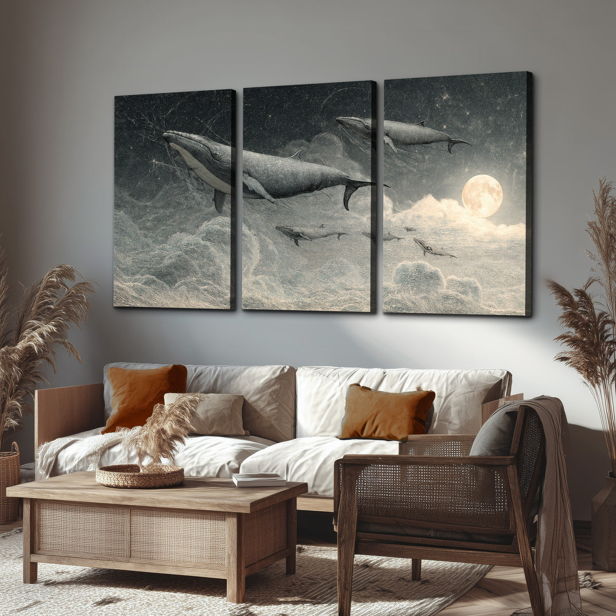 Monochrome whales floating over misty clouds beside a luminous painted moon 3 piece canvas wall art displayed in a rustic living room