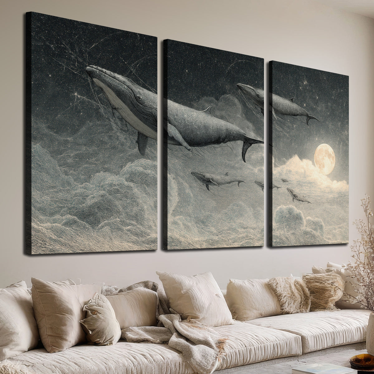 Monochrome whales floating over misty clouds beside a luminous painted moon 3 piece canvas wall art room and product view